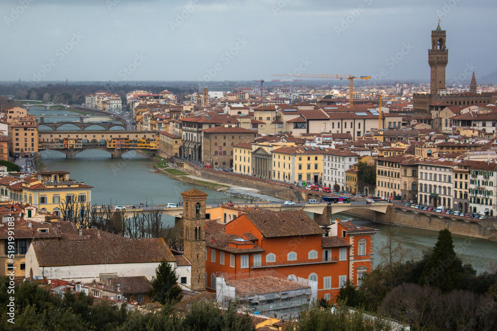 View of the city of Florence, Italy, during sunset on a cloudy day.  
