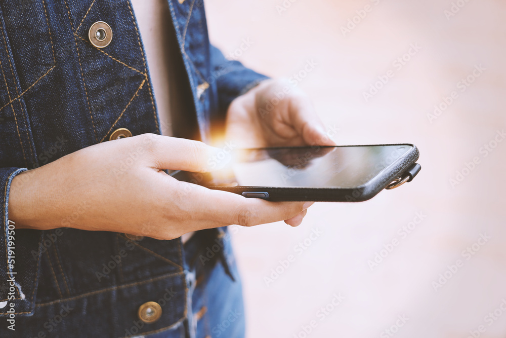 Close-up photo of a woman hand using a smartphone