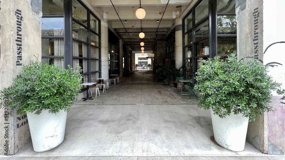 LOS ANGELES, CA, APR 2022 wide view passage through building at The Row, repurposed industrial