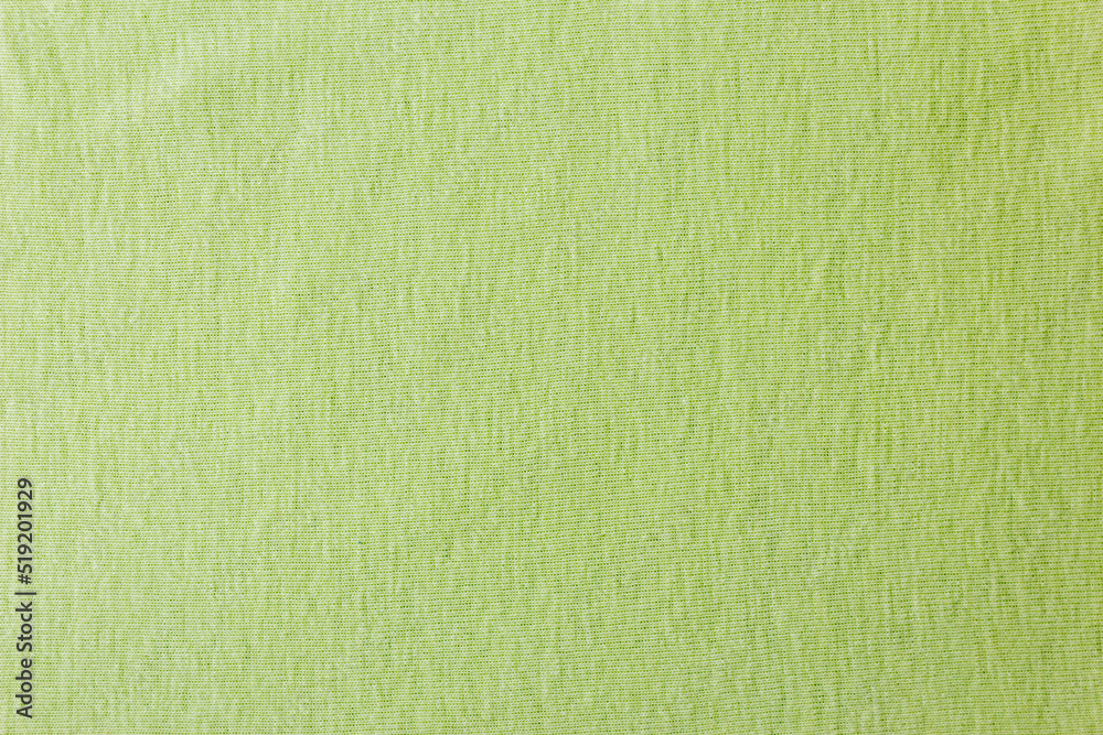 Cotton linen woven fabric texture background in light pale lime green color. Green cloth texture background. Fabric bright ecological canvas wallpaper with delicate striped pattern. Cotton linen woven fabric texture background in light pale lime green color. Green cloth texture background. Fabric bright ecological canvas wallpaper with delicate striped pattern.