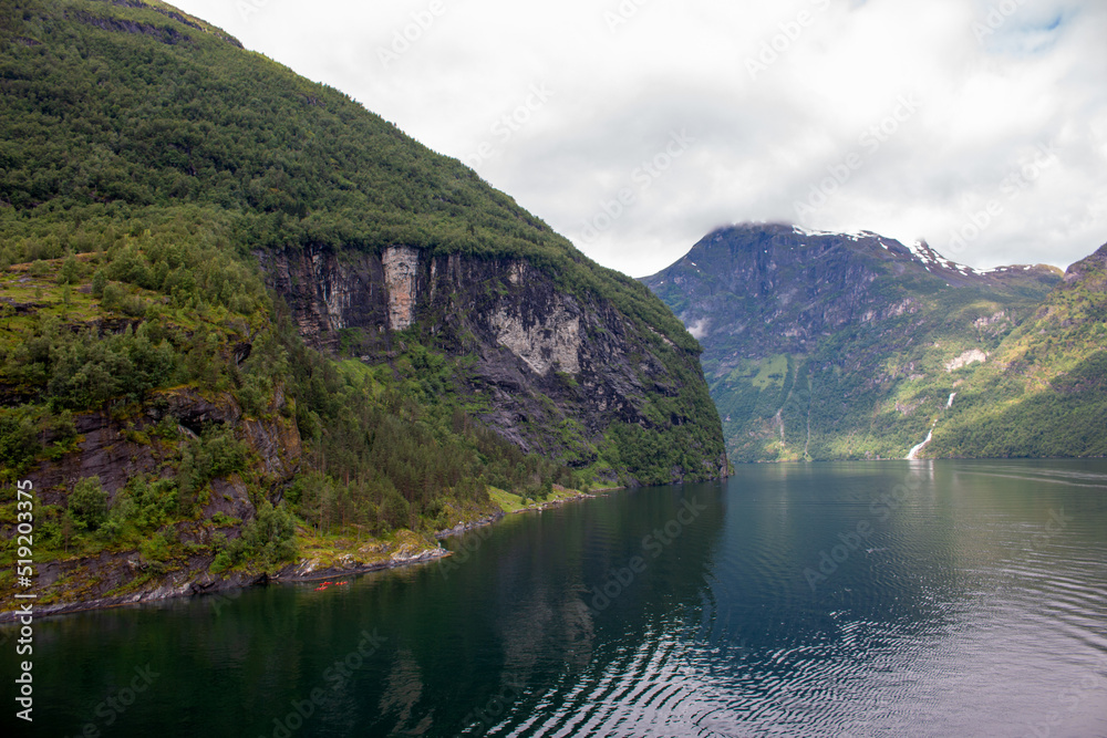 Landscape at the Geiranger fjords near Geiranger town from harbor Møre og Romsdal at Geirangerfjorden in Norway (Norwegen, Norge or Noreg) Landscape at the Geiranger fjords near Geiranger town from harbor Møre og Romsdal at Geirangerfjorden in Norway (Norwegen, Norge or Noreg)