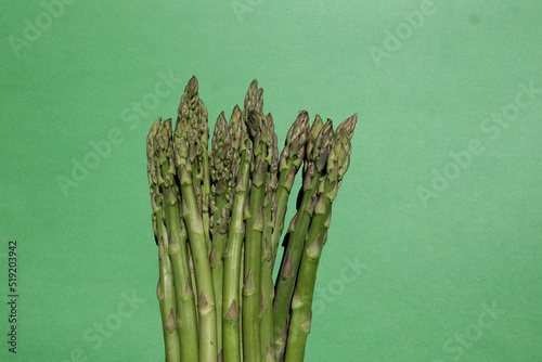 Fresh green asparagus on green background. Fresh green asparagus on green background