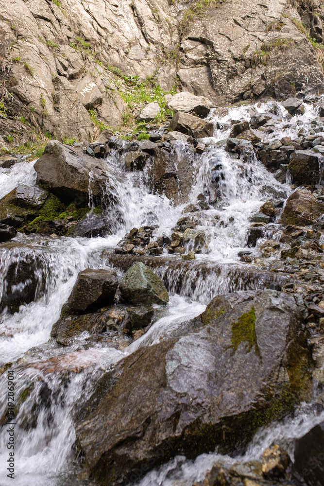 mountain river flows fast over rocks close-up mountain river flows fast over rocks close-up