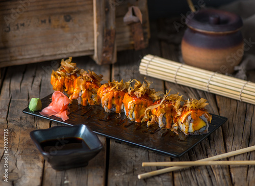 HANAKO maki served in a dish isolated on wooden background side view photo