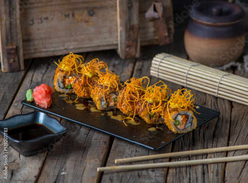 KAZUKI maki served in a dish isolated on wooden background side view photo