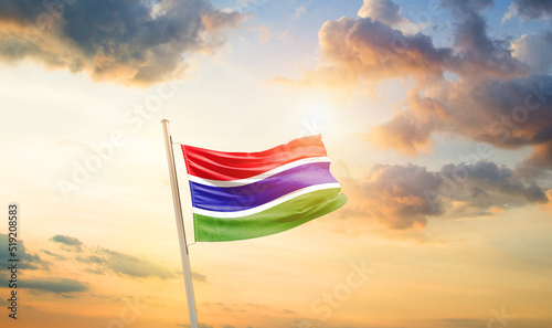 Gambia national flag cloth fabric waving on the sky - Image © Faraz