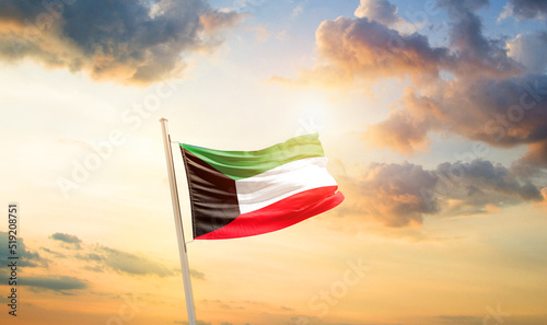 Kuwait national flag cloth fabric waving on the sky - Image photo