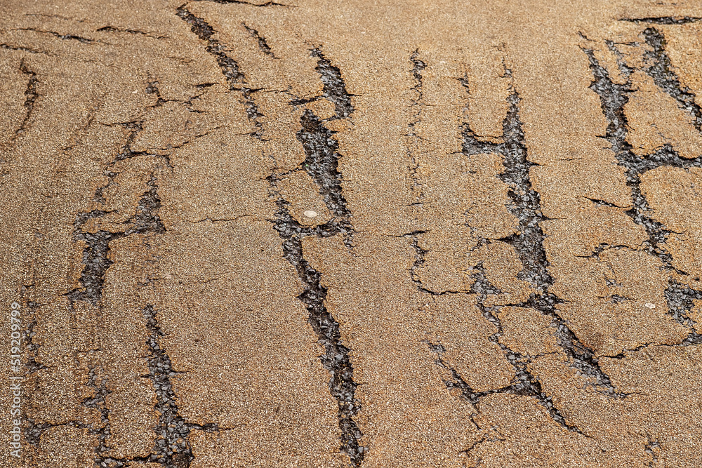 Old foot path surface with claw style scratches. Worn out side walk. Old foot path surface with claw style scratches. Worn out side walk.