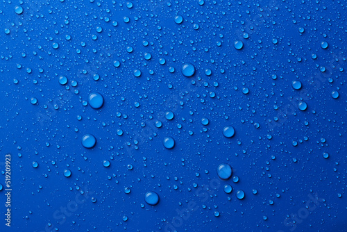 Water drops on blue background  top view