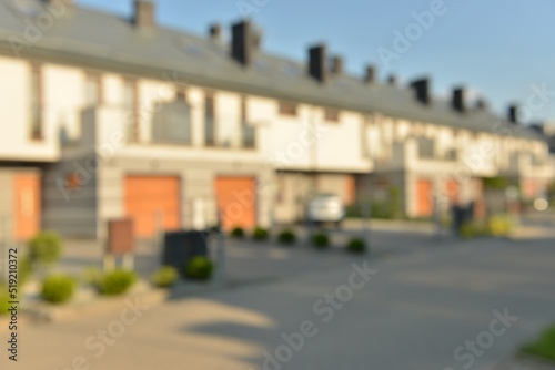 Blurred view of suburban street with beautiful houses