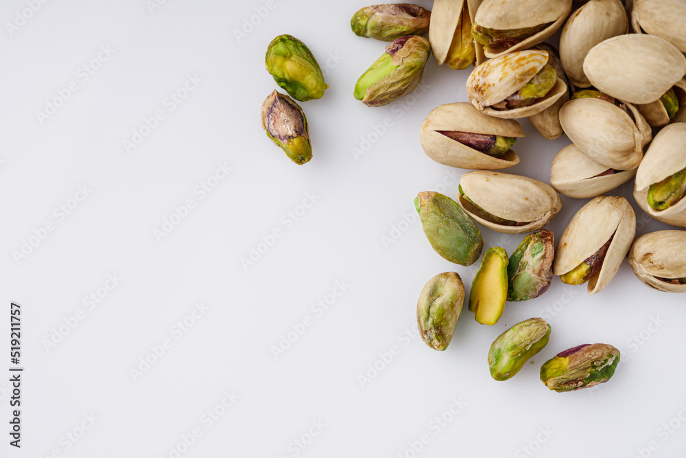 fresh salted pistachios on a white background fresh salted pistachios on a white background