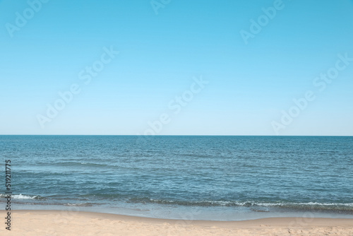 Fototapeta Naklejka Na Ścianę i Meble -  Beautiful view of sea shore under blue sky on sunny day