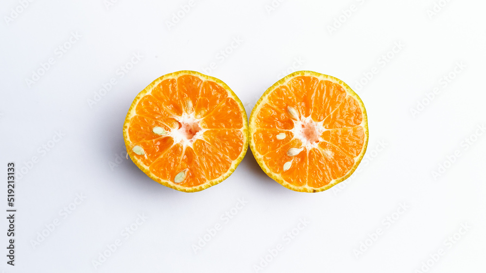 Fototapeta premium Close-up of freshly cut orange fruit isolated on white background