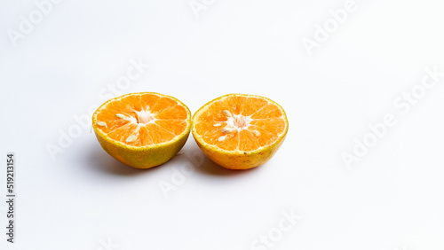Close-up of freshly cut orange fruit isolated on white background