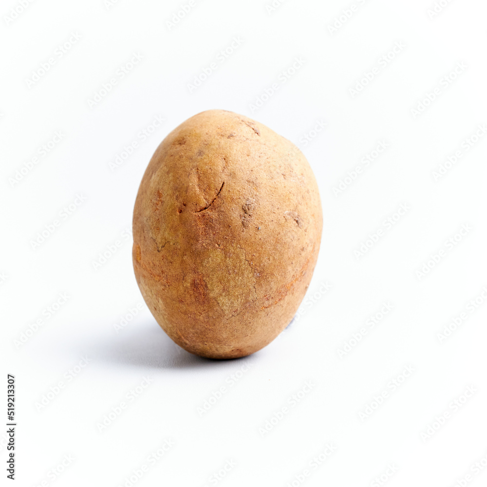 Close-up of whole and fresh sapodilla fruit isolated on a white background Close-up of whole and fresh sapodilla fruit isolated on a white background