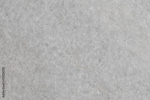 Natural stone tile in light gray color with scratches and marble effect.