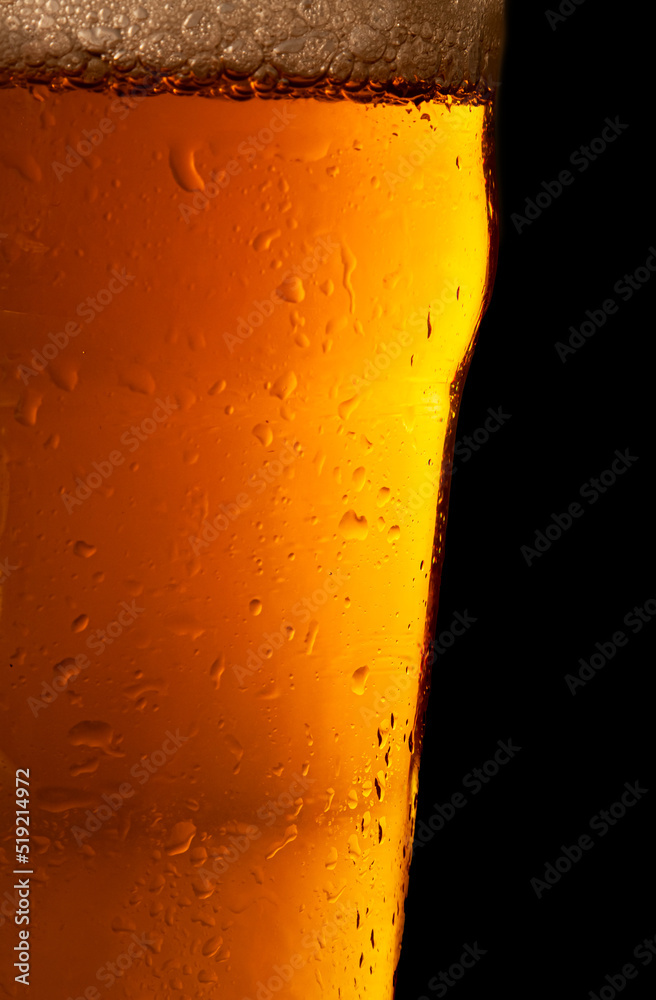 Beer bubbles in a mug, close-up image with space for text. Beer bubbles in a mug, close-up image with space for text.