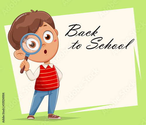 Cute schoolboy with magnifying glass