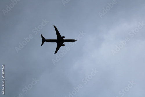 Plane flyining in cloudy sky