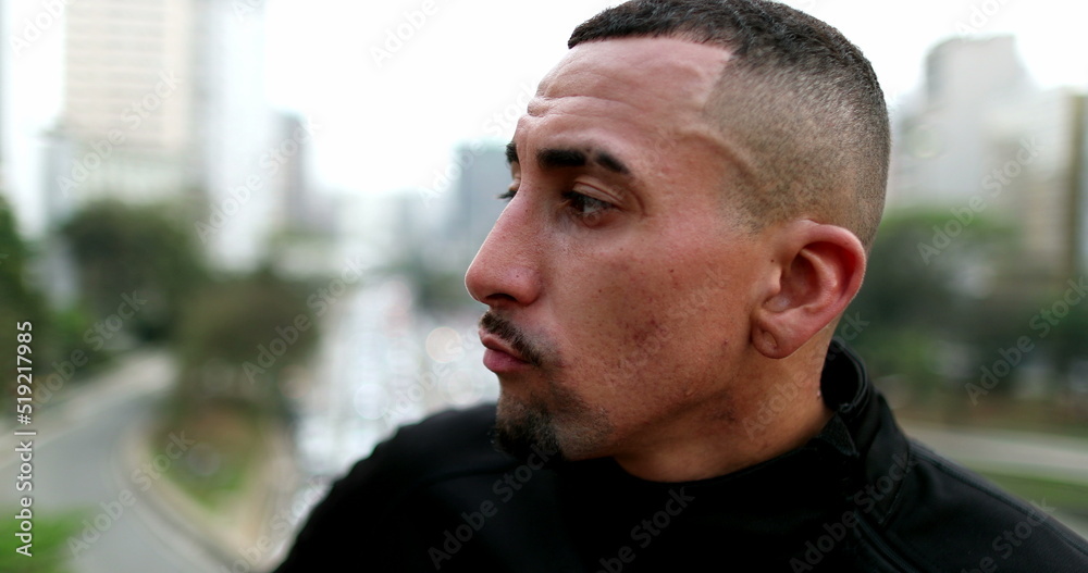 Serious hispanic man in downtown city. Pensive mixed race guy Serious hispanic man in downtown city. Pensive mixed race guy