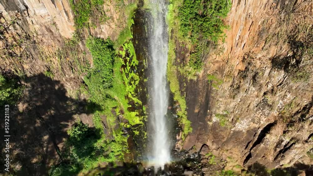 Slow Motion waterfall at scenic gorge canyon. Peaking waterfall landscape. Nature background. Waterfalls cascade at gorge canyons background. Geologycal formation ecosystem. Waterfalls landscape. Slow Motion waterfall at scenic gorge canyon. Peaking waterfall landscape. Nature background. Waterfalls cascade at gorge canyons background. Geologycal formation ecosystem. Waterfalls landscape.