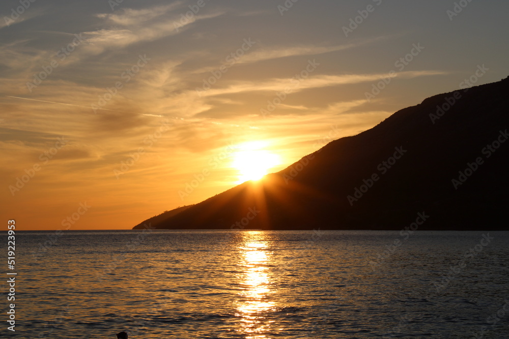Sunset at the beach with mountain
