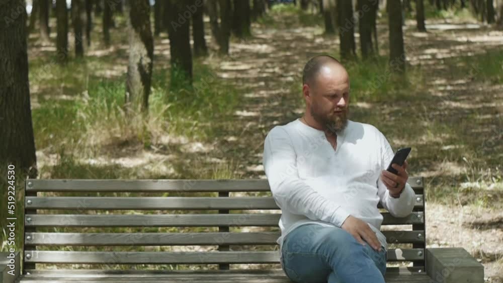 White man in a white shirt talking on the phone White man in a white shirt talking on the phone