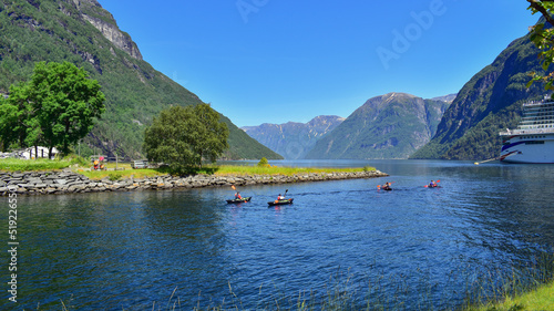 Kayaking in beautiful fjord, lake and mountains landscape