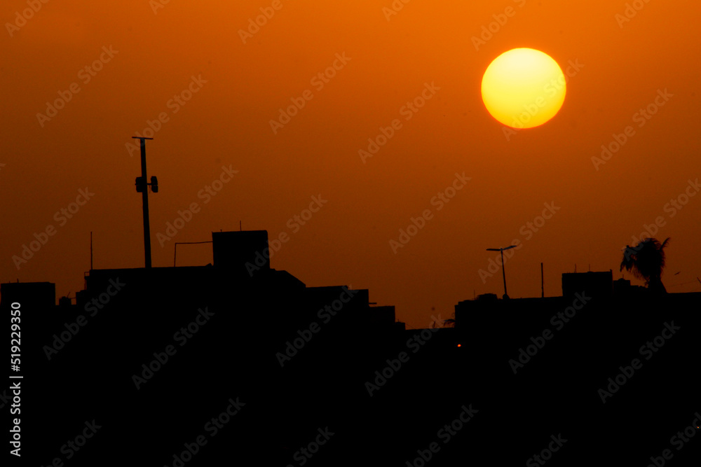 A silhouette sunset in city. sunset in the city. 