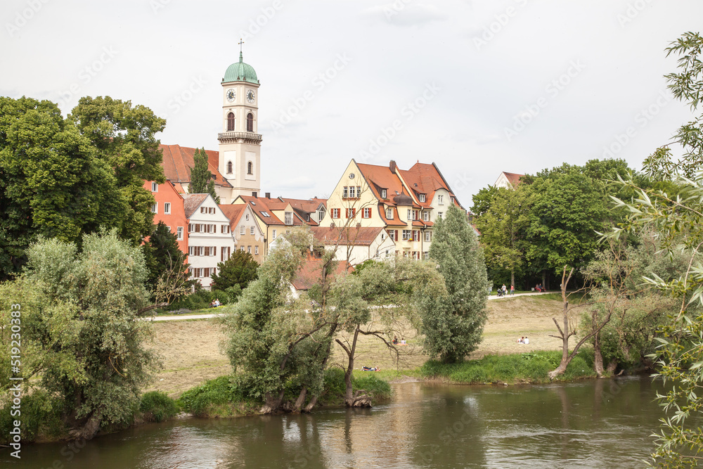 Scenic spring view of old buildings at Danube river pier and street architecture in the Old Town of Regensburg, Bavaria, Germany