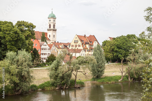 Scenic spring view of old buildings at Danube river pier and street architecture in the Old Town of Regensburg, Bavaria, Germany