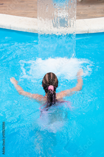 A teenage girl bathes in the pool. Summer. Vacation. © Natalya Temnaya