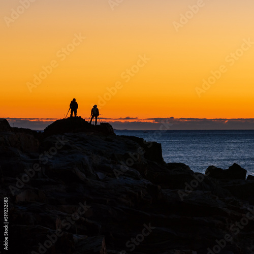 photographers at coast at sunrise