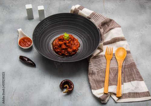 dish of pork stew in red chili called asado de bodas, and which is accompanied by salt, pepper and dried chilies.