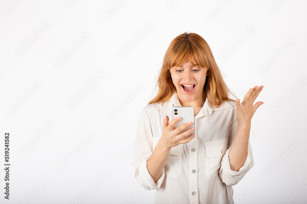 Young businesswoman portrait with smartphone in studio.