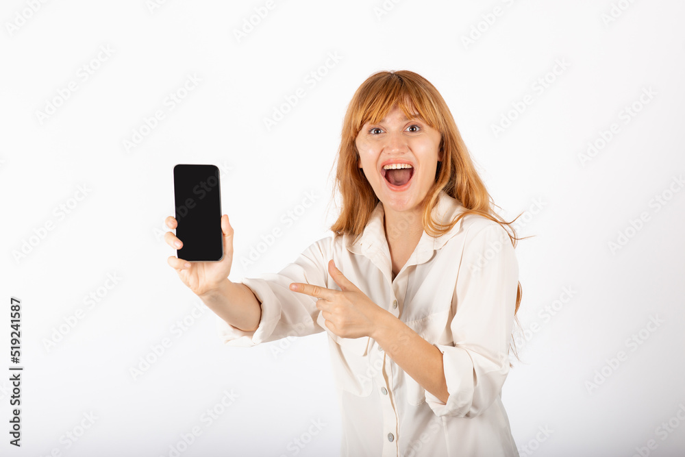 Young businesswoman portrait with smartphone in studio. Young businesswoman portrait with smartphone in studio.