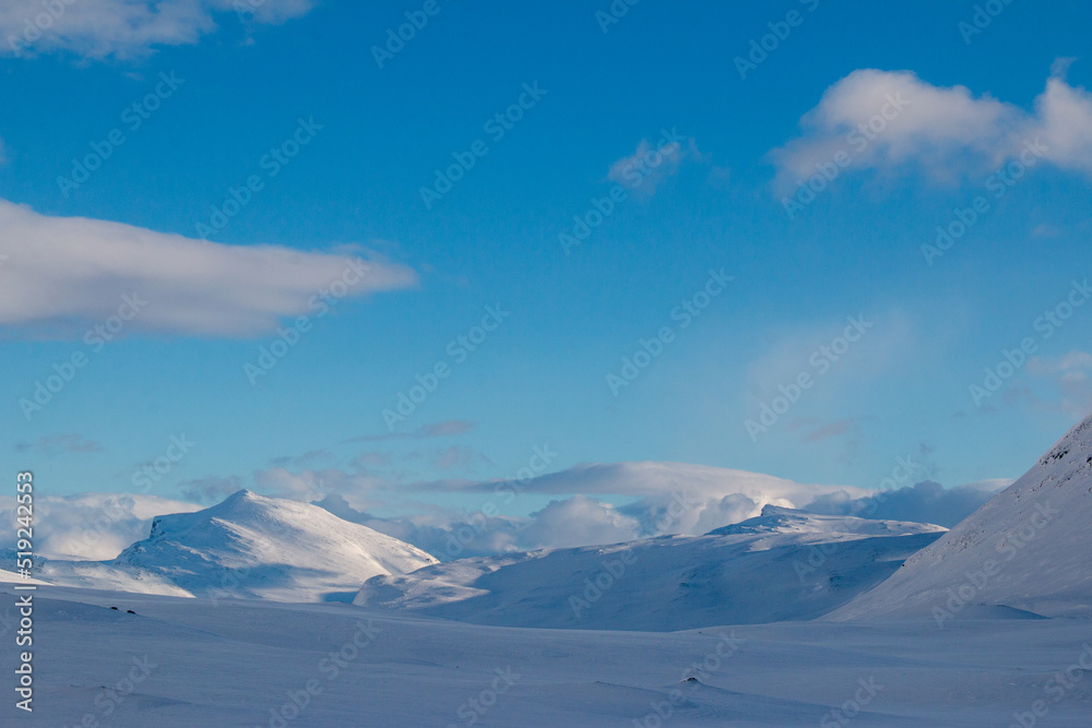 Snow covered mountains near Salka mountain hut on Kungsleden trail, winter season, Lapland, Sweden