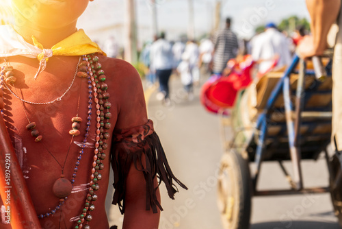 Unrecognizable boy characterizing a native Nicaraguan Indian, part of the Santo Domingo de Guzman tradition in Managua, Nicaragua