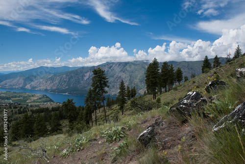 View of Lake Chelan Washington, dark clouds covering mountain top