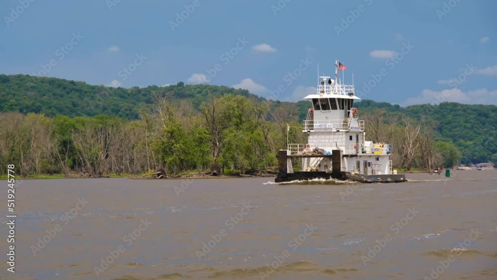 Towboat with no cargo moving on the Mississippi River Towboat with no cargo moving on the Mississippi River