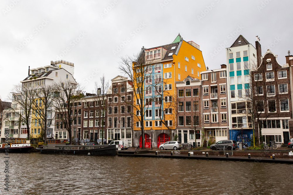 Typical Amsterdam cityscape. Amsterdam canals, boats and dutch architecture, Netherlands