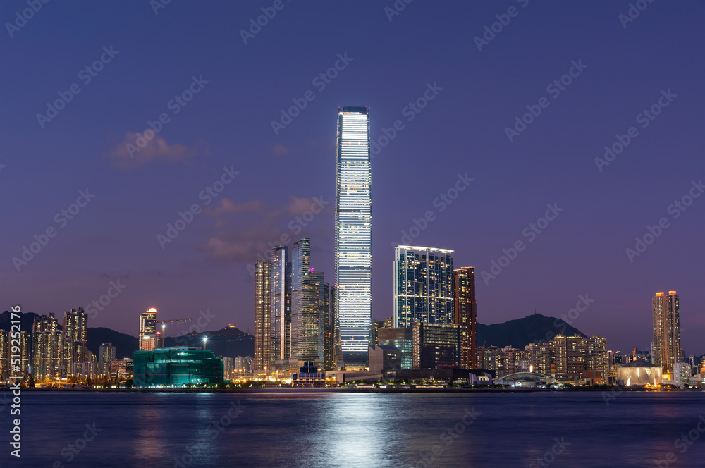 Scenery of skyscraper, skyline and harbor of Hong Kong city at dusk