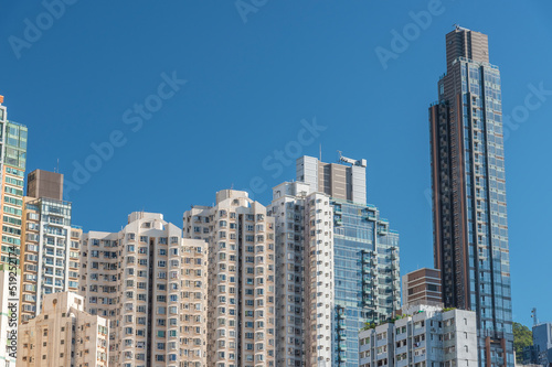 Exterior of high rise residential building in Hong Kong city © leeyiutung