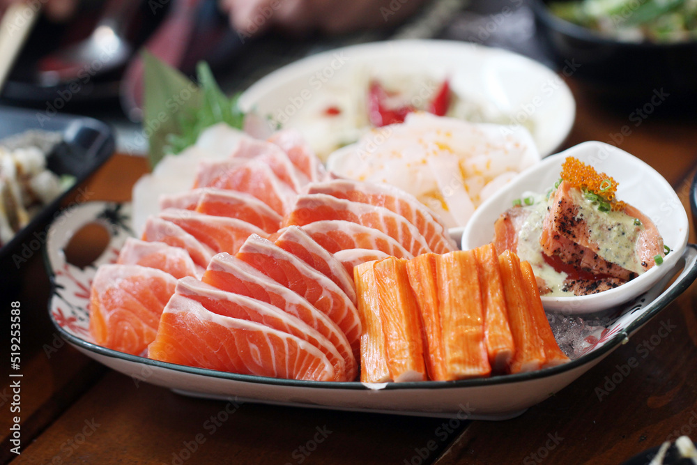 Set of salmon sashimi and crab sticks,japanese food style Set of salmon sashimi and crab sticks,japanese food style