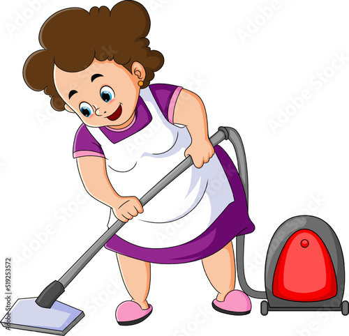 The maid is helping to clean the floor from the dust with vacuum cleaner