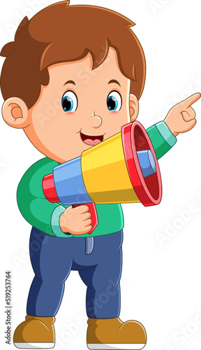 The boy is pointing on something and using a loudspeaker
