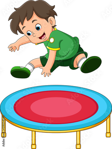 The boy is doing the attraction and jumping on the trampoline