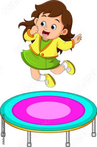 The cute girl is jumping on the trampoline very high