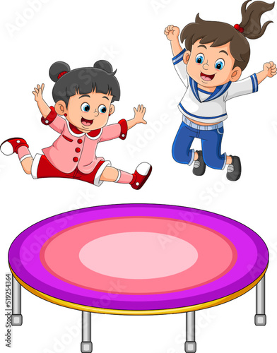 The twin girl is jumping together and giving the happy expression