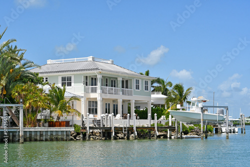 Fototapeta Waterfront homes and boats along the waterway in Marathon key in the Florida Key